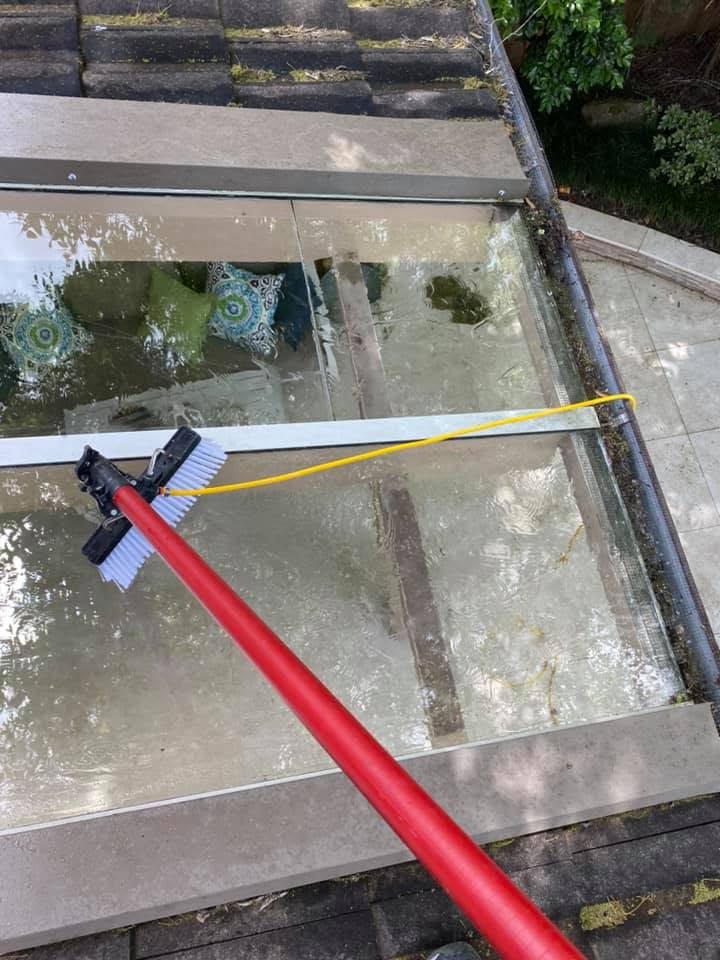 A Nice Clean Windows water-fed pole brush mid-clean on a skylight